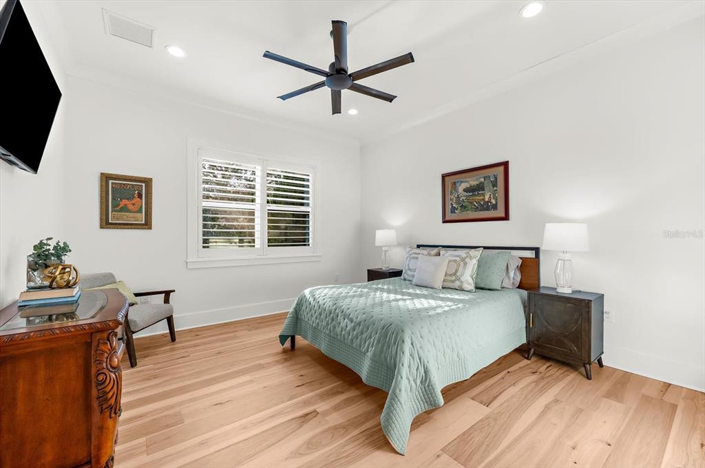 1044 Riverside Ridge Road Tarpon Springs, FL 34688 - Photo 38 of 77 a bedroom with a bed window and a table