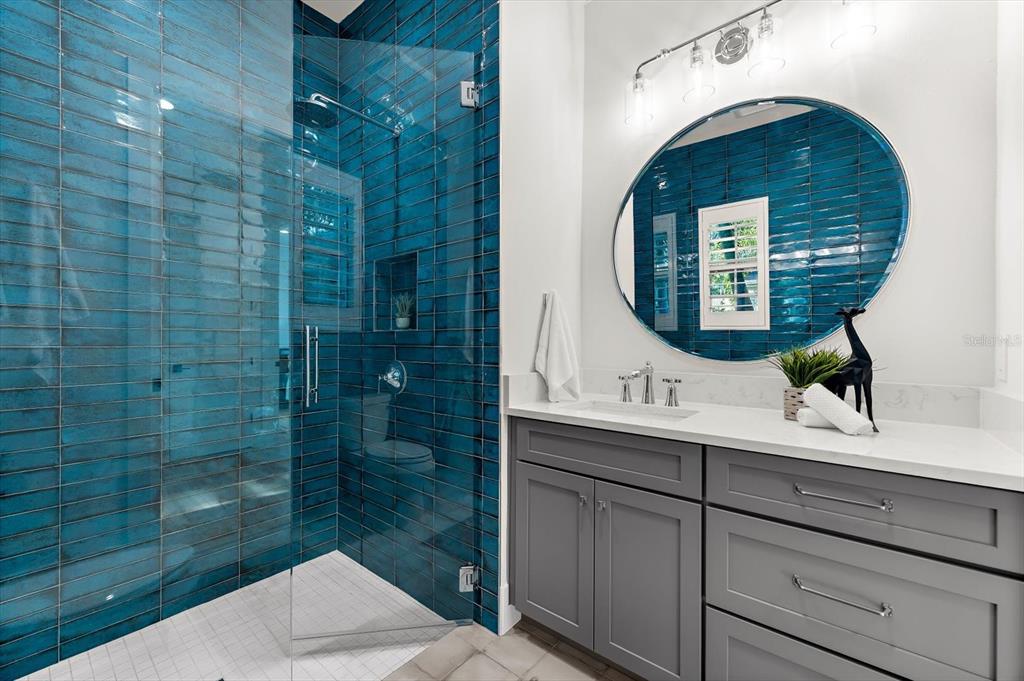 1044 Riverside Ridge Road Tarpon Springs, FL 34688 - Photo 40 of 77 a bathroom with a sink and mirror