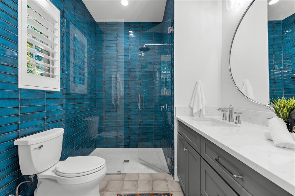 1044 Riverside Ridge Road Tarpon Springs, FL 34688 - Photo 41 of 77 a bathroom with a sink a toilet and shower