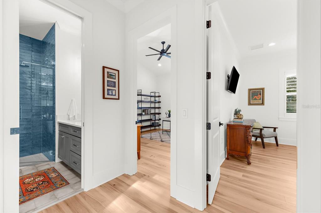1044 Riverside Ridge Road Tarpon Springs, FL 34688 - Photo 42 of 77 a view of a hallway with wooden floor and dining room