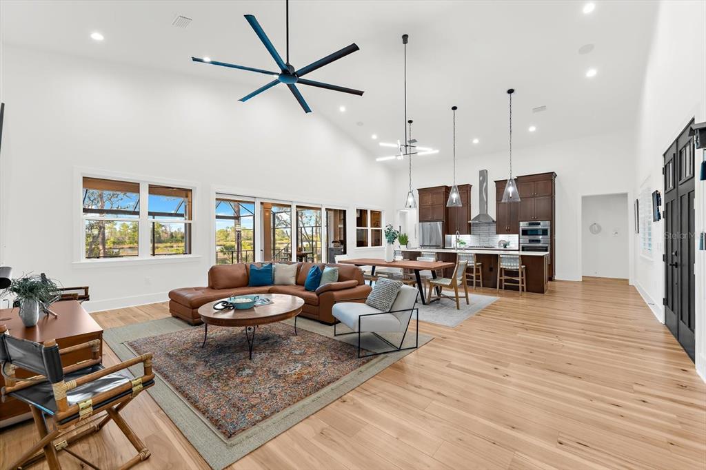 1044 Riverside Ridge Road Tarpon Springs, FL 34688 - Photo 6 of 77 a living room with furniture and a large window