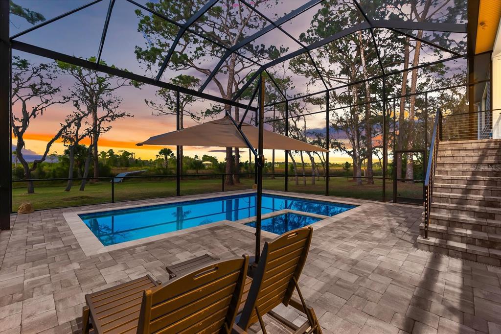 1044 Riverside Ridge Road Tarpon Springs, FL 34688 - Photo 65 of 77 a view of a swimming pool with a patio