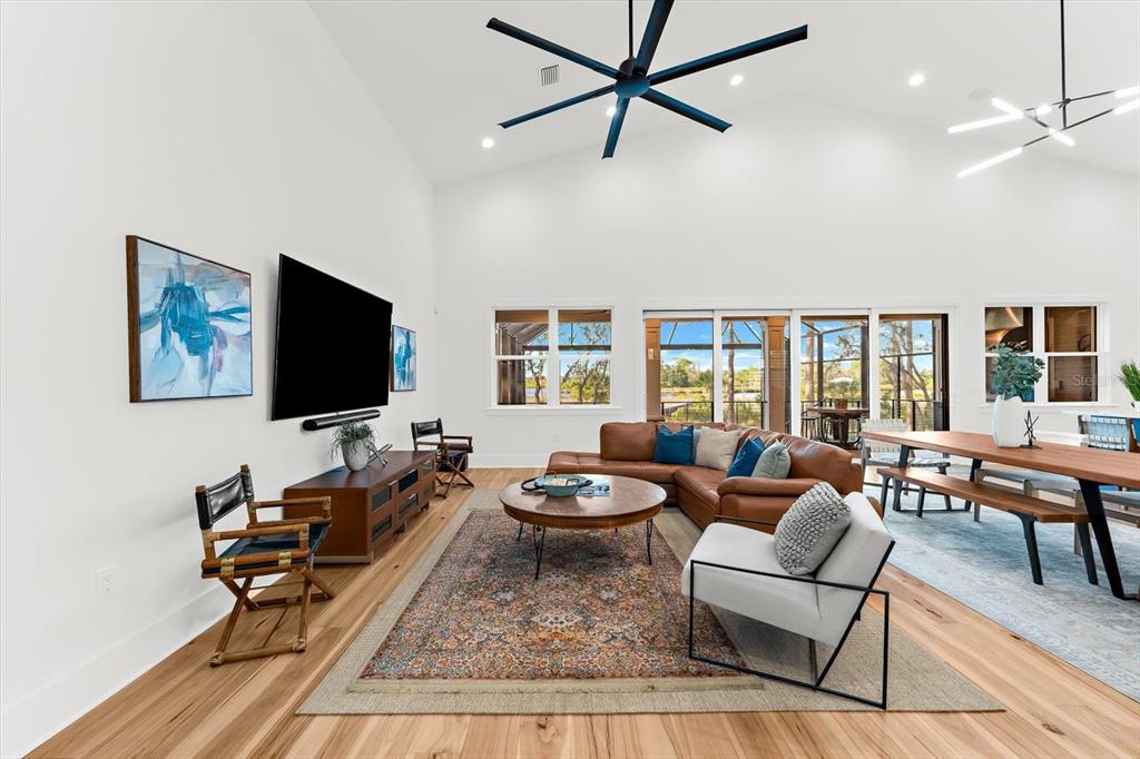 1044 Riverside Ridge Road Tarpon Springs, FL 34688 - Photo 7 of 77 a living room with furniture and a flat screen tv