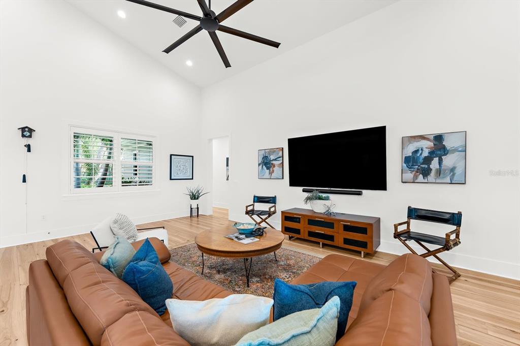 1044 Riverside Ridge Road Tarpon Springs, FL 34688 - Photo 8 of 77 a living room with furniture and a flat screen tv