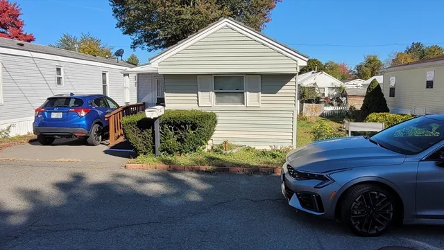 a front view of a house with parking space