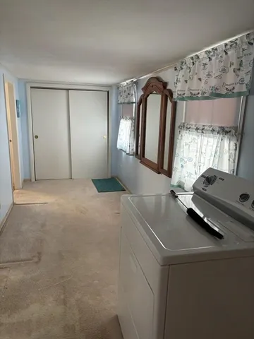 a view of livingroom with furniture and window