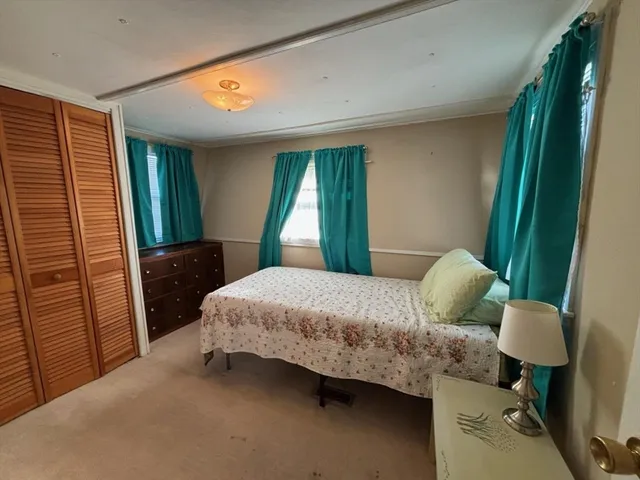 a view of a balcony with furniture and wooden floor