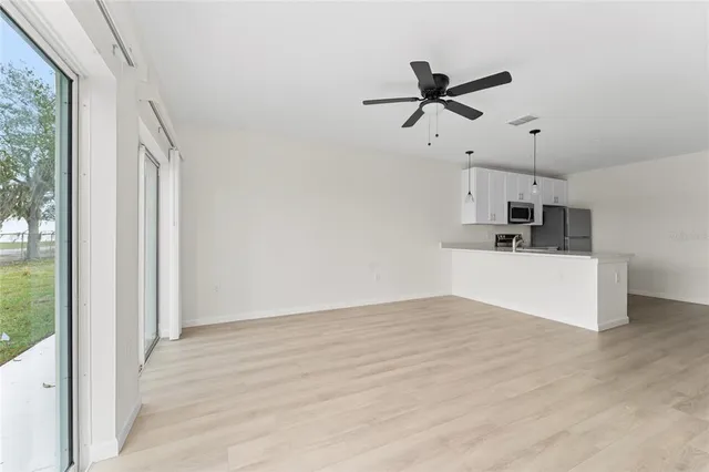 a view of a kitchen with a sink and cabinet area