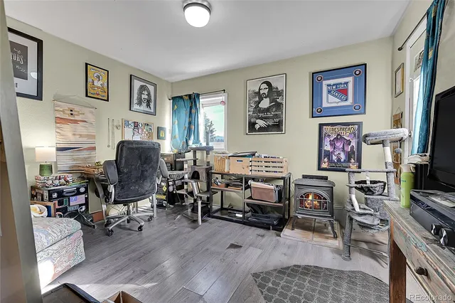 a view of a livingroom with workspace and a couch