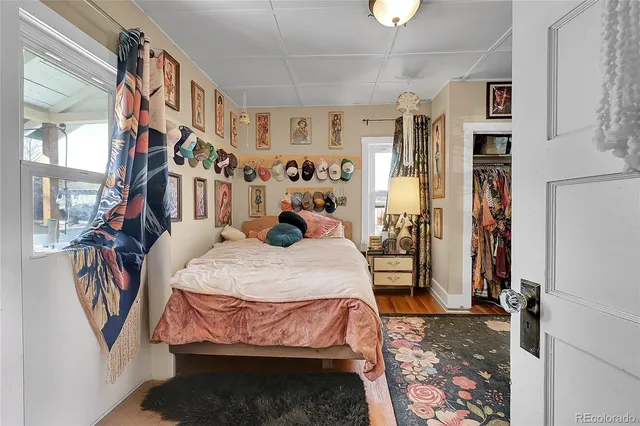 a bed room with a bed and a chandelier