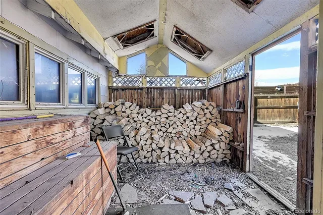 a front view of a house with a large window