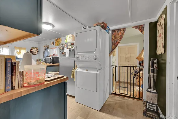 a utility room with multiple dryer and washer