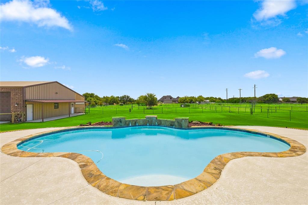 420 Hartley Way Azle, TX 76020 - Photo 29 of 40 Freeform swimming pool with natural stone coping and integrated water features