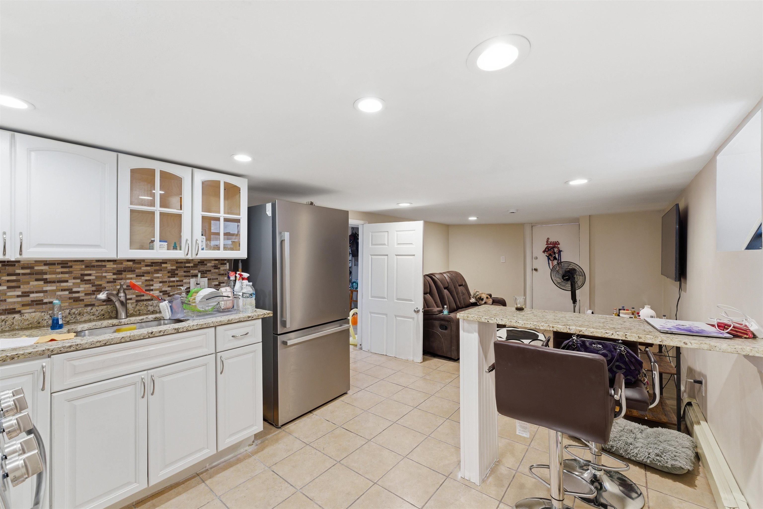 921 Paterson Plank Road North Bergen, NJ 07047 - Photo 17 of 50 a kitchen with stainless steel appliances granite countertop a refrigerator and a stove top oven