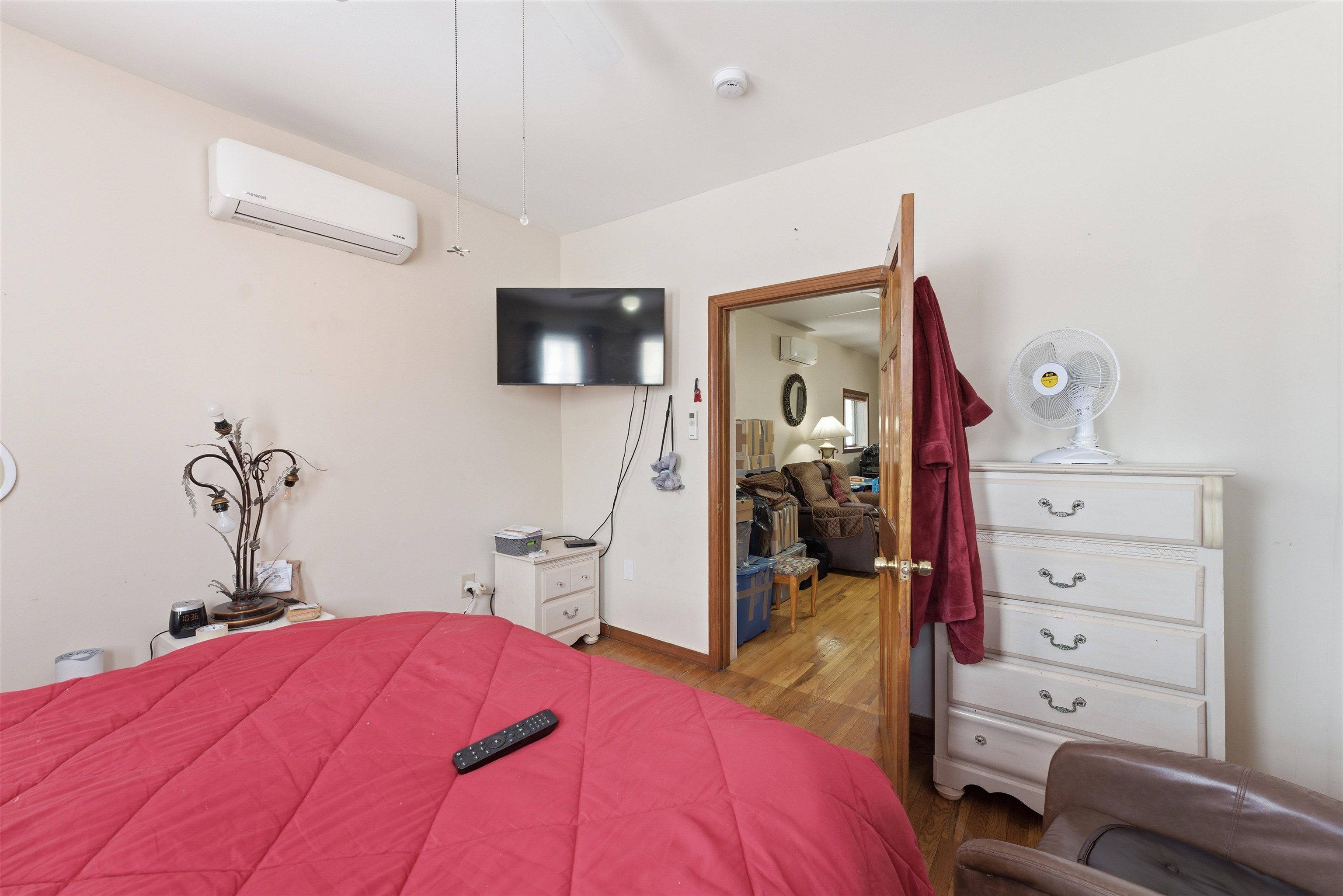 921 Paterson Plank Road North Bergen, NJ 07047 - Photo 24 of 50 a bedroom with a bed and a flat screen tv