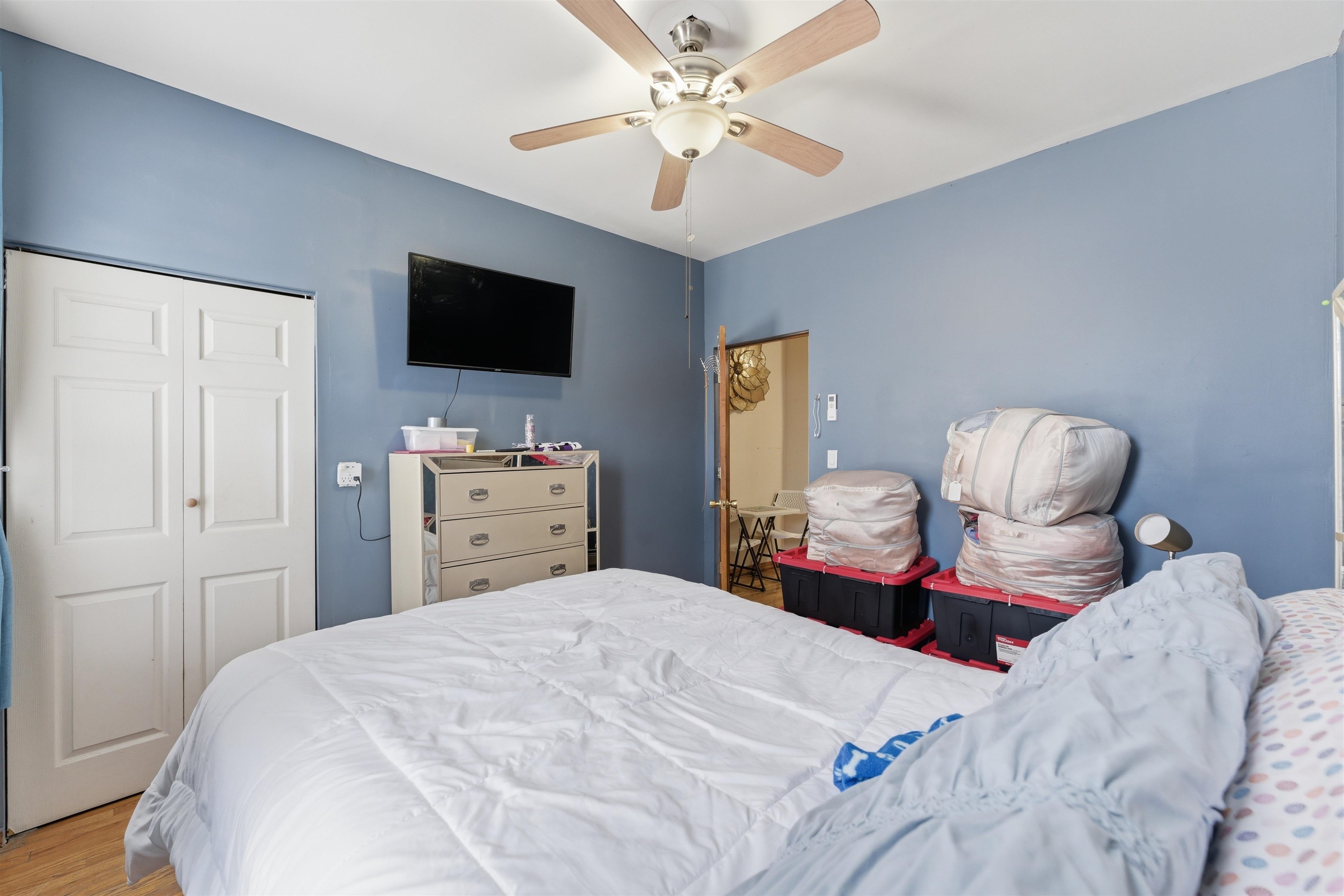 921 Paterson Plank Road North Bergen, NJ 07047 - Photo 28 of 50 a bedroom with a bed and a flat screen tv