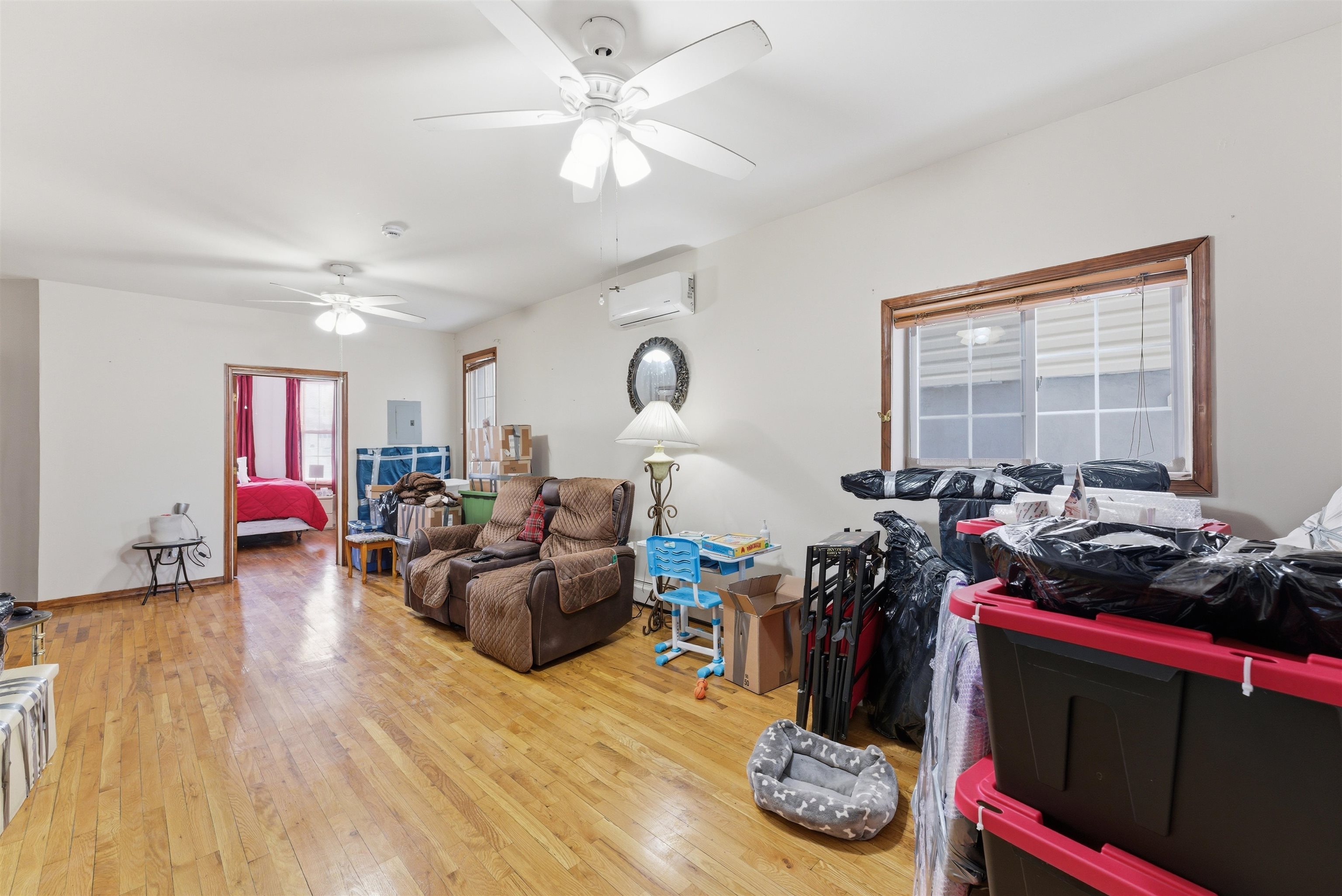 921 Paterson Plank Road North Bergen, NJ 07047 - Photo 30 of 50 a living room with furniture and a window