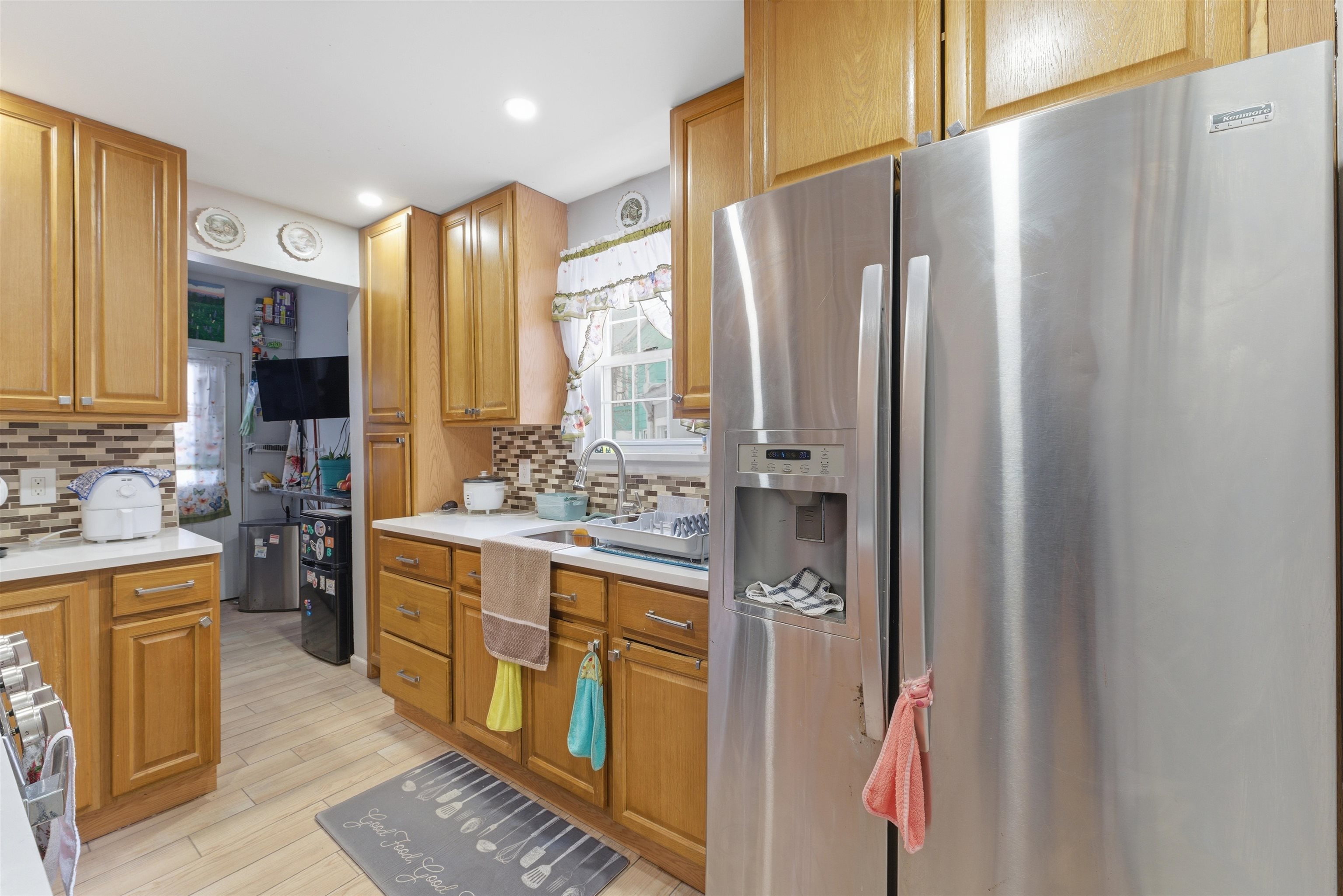 921 Paterson Plank Road North Bergen, NJ 07047 - Photo 31 of 50 a kitchen with stainless steel appliances a refrigerator and cabinets