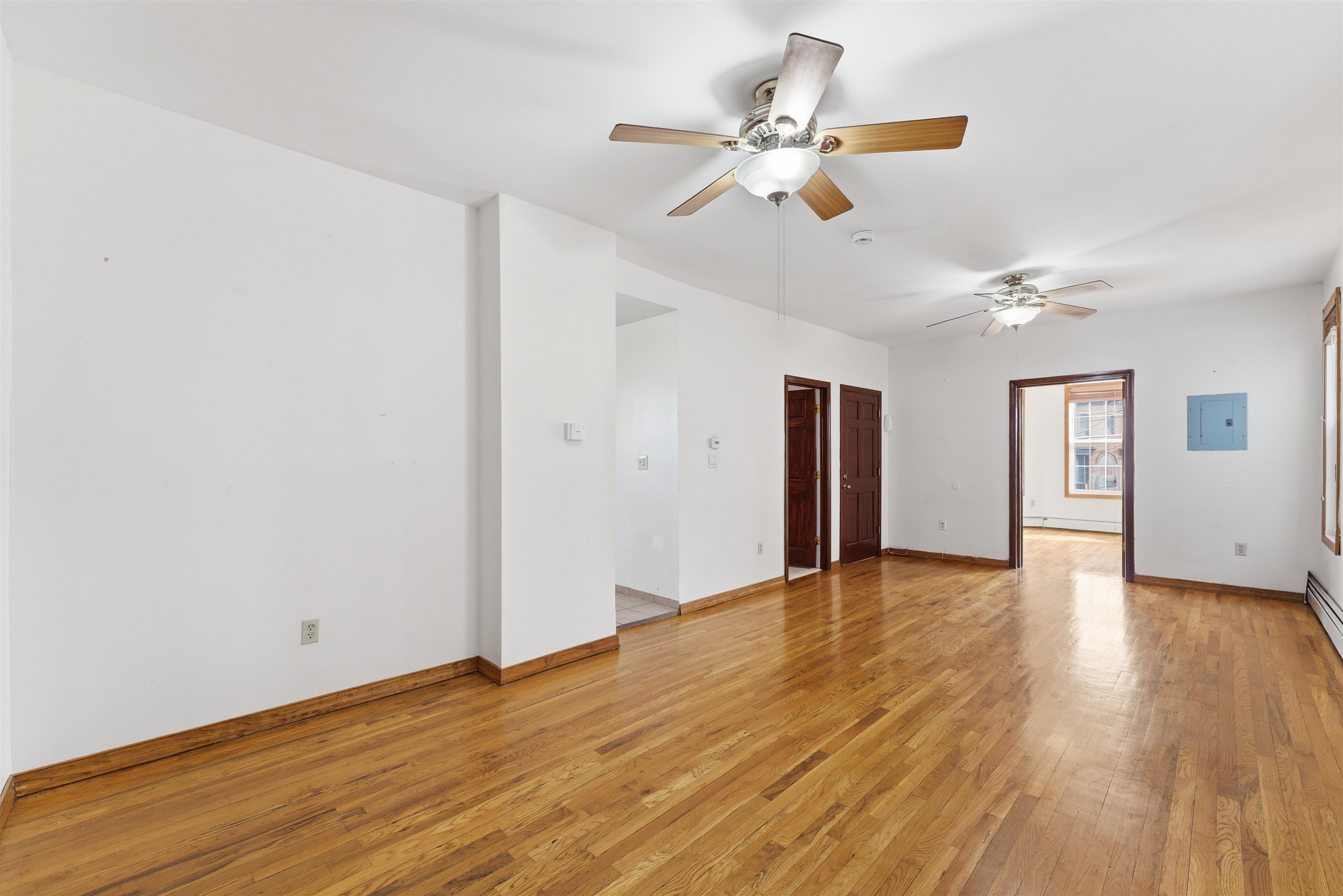 921 Paterson Plank Road North Bergen, NJ 07047 - Photo 35 of 50 a view of an empty room with wooden floor