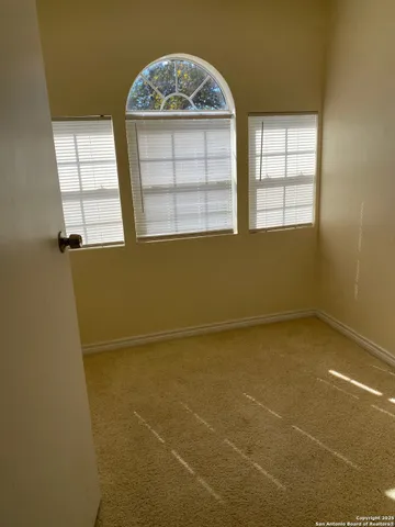 a view of a room that has a window in it