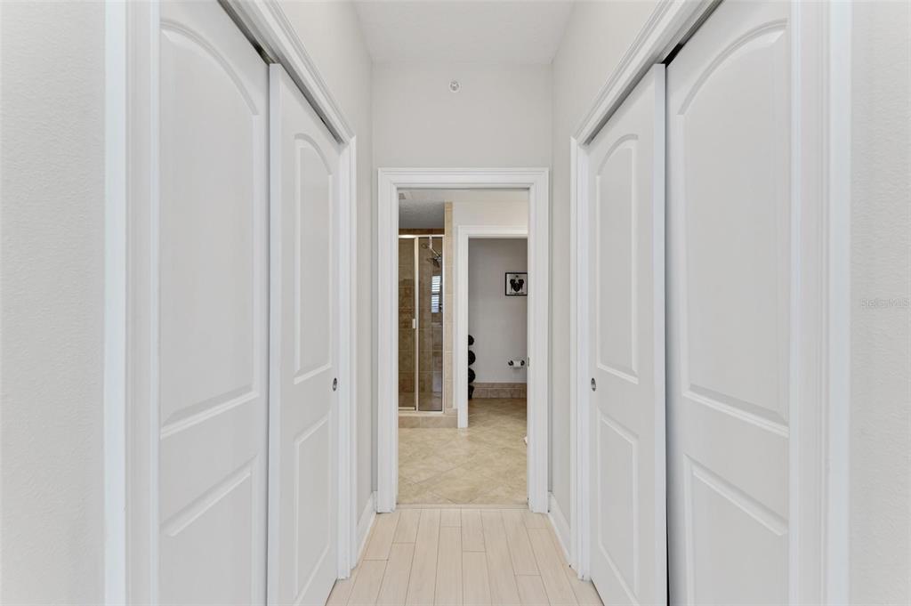 611 Riviera Dunes Way, Unit 304 Palmetto, FL 34221 - Photo 17 of 30 a view of a hallway with a wooden door