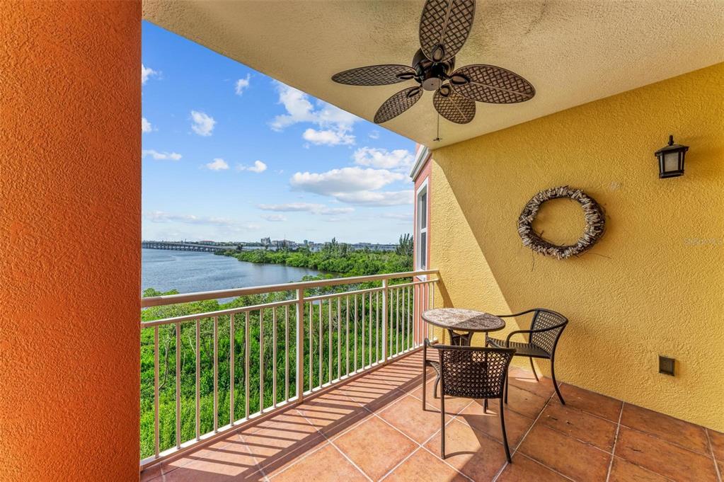 611 Riviera Dunes Way, Unit 304 Palmetto, FL 34221 - Photo 24 of 30 a view of a balcony with table and chairs