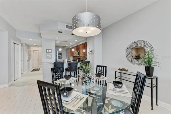 a view of a dining room with furniture and wooden floor