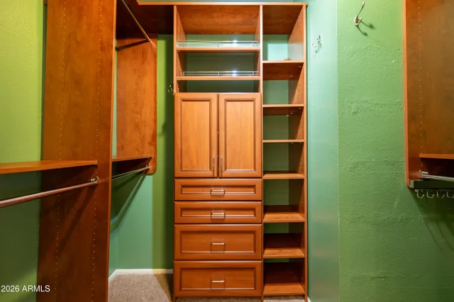 a view of swimming pool with outdoor seating and plants