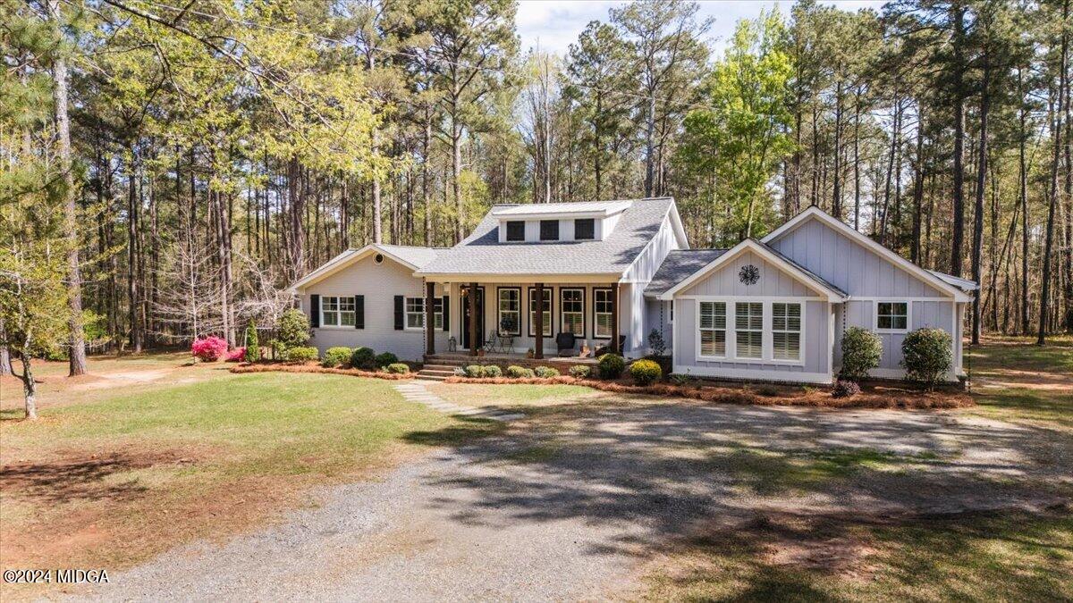 280 Joe Chambers Road Forsyth, GA 31029 - Photo 1 of 55 a front view of a house with a yard