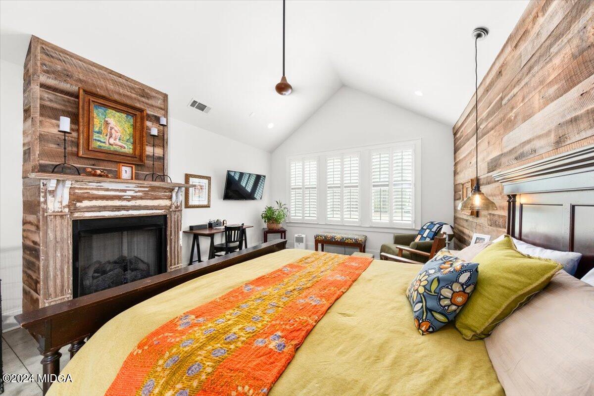 280 Joe Chambers Road Forsyth, GA 31029 - Photo 13 of 55 a bed room with a bed and a fireplace
