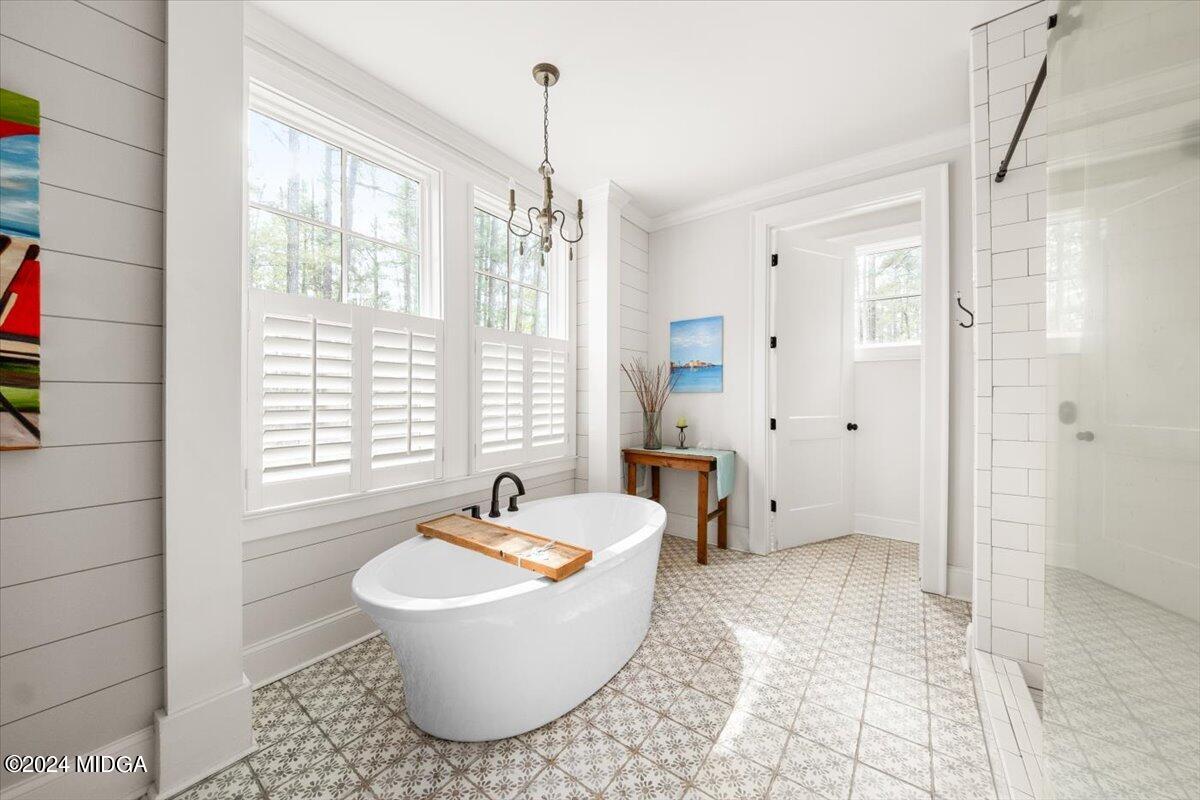 280 Joe Chambers Road Forsyth, GA 31029 - Photo 16 of 55 a bathroom with a bathtub and shower