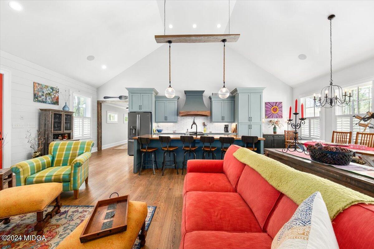 280 Joe Chambers Road Forsyth, GA 31029 - Photo 20 of 55 a living room with furniture kitchen view and a chandelier