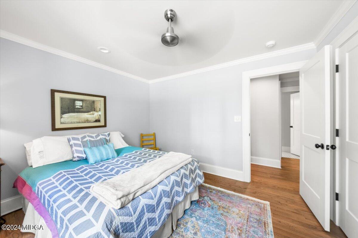 280 Joe Chambers Road Forsyth, GA 31029 - Photo 23 of 55 a bedroom with a bed and wooden floor