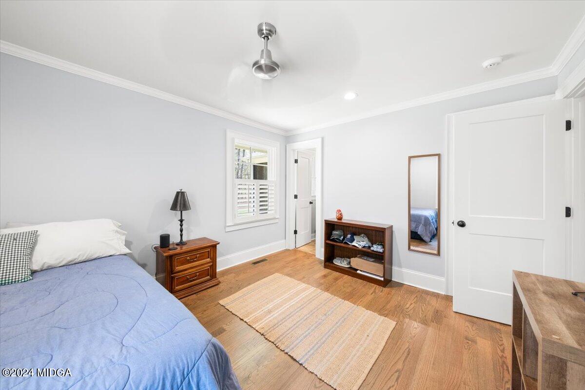 280 Joe Chambers Road Forsyth, GA 31029 - Photo 25 of 55 a bedroom with furniture and a wooden floor