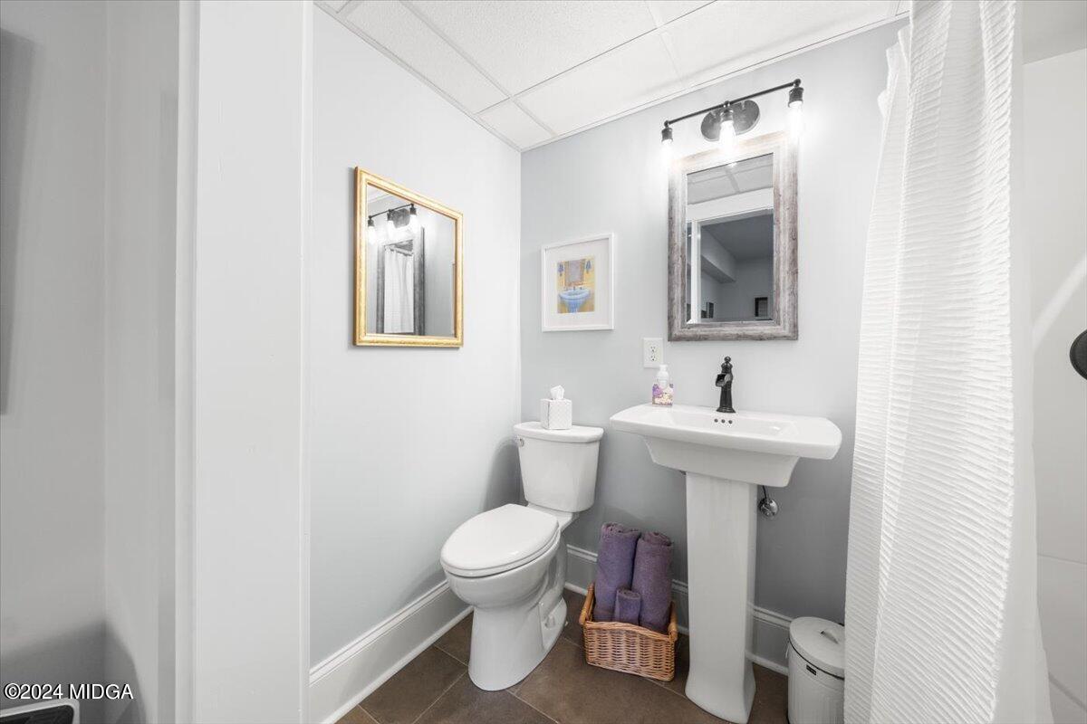280 Joe Chambers Road Forsyth, GA 31029 - Photo 29 of 55 a bathroom with a toilet sink and mirror