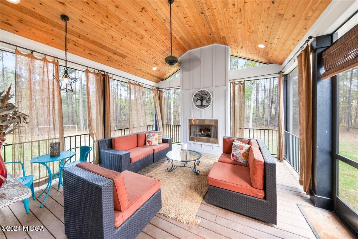 280 Joe Chambers Road Forsyth, GA 31029 - Photo 33 of 55 a outdoor living space with furniture and garden view