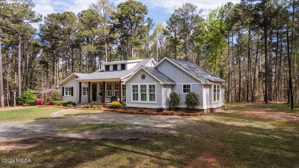 280 Joe Chambers Road Forsyth, GA 31029 - Photo 45 of 55 a front view of a house with a garden