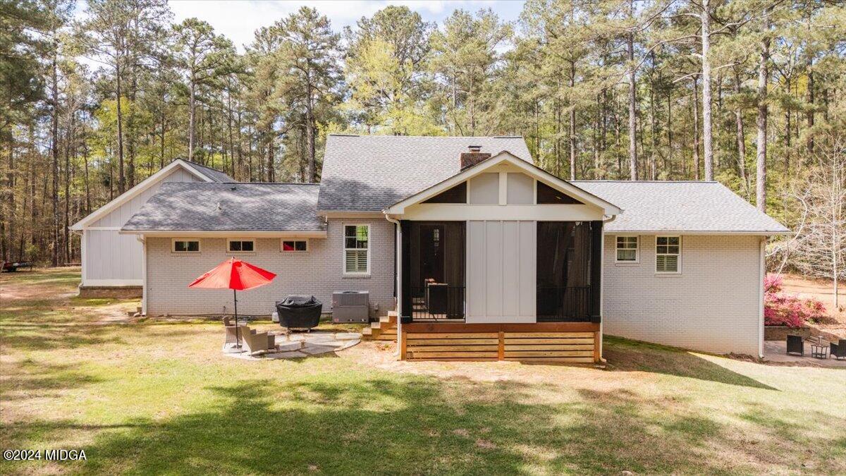 280 Joe Chambers Road Forsyth, GA 31029 - Photo 47 of 55 a view of a house with a yard and garage