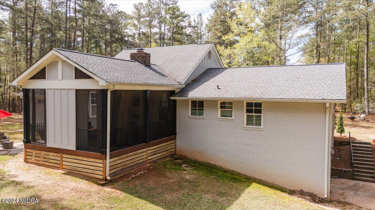 280 Joe Chambers Road Forsyth, GA 31029 - Photo 48 of 55 a view of a white house with a small yard and large tree