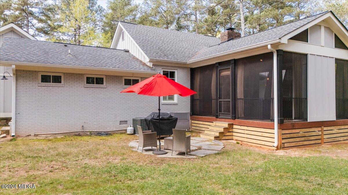 280 Joe Chambers Road Forsyth, GA 31029 - Photo 51 of 55 a backyard of a house with table and chairs