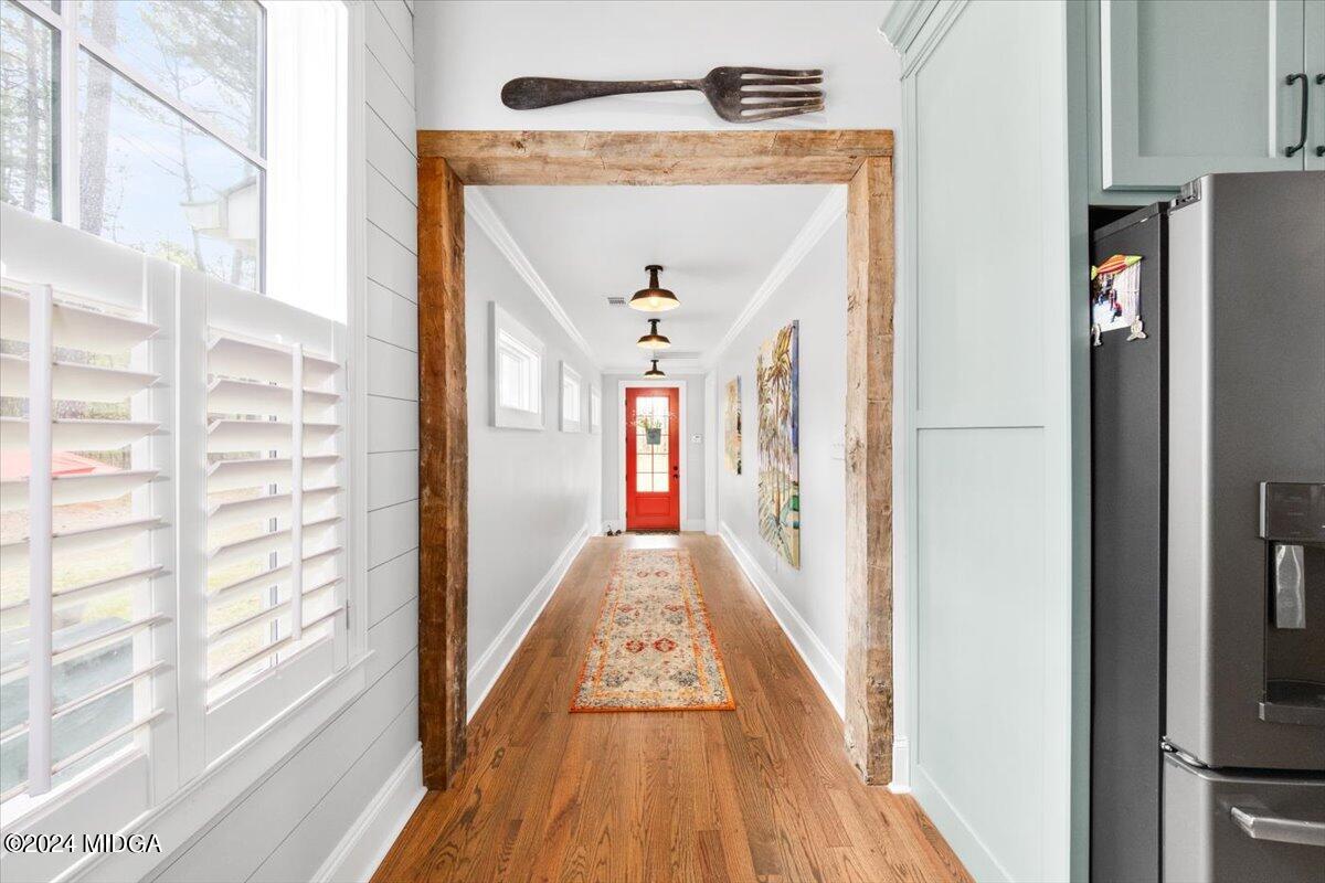 280 Joe Chambers Road Forsyth, GA 31029 - Photo 6 of 55 a view of a hallway with wooden floor and staircase