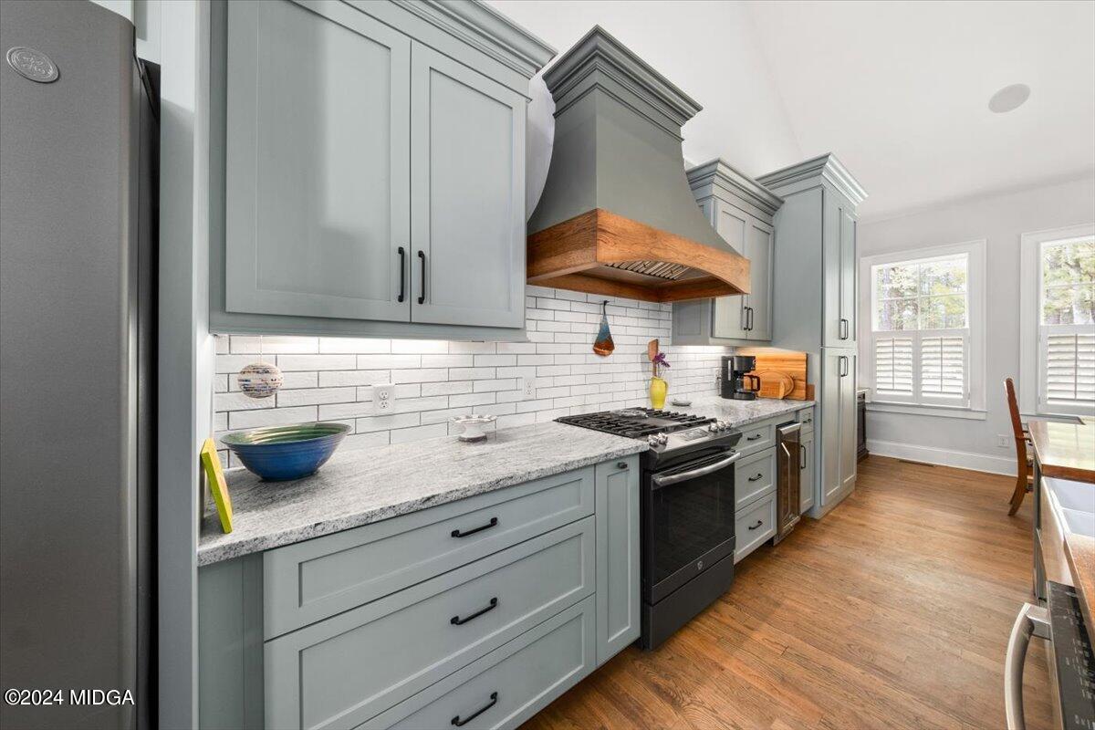280 Joe Chambers Road Forsyth, GA 31029 - Photo 8 of 55 a kitchen with stainless steel appliances granite countertop a sink and a stove