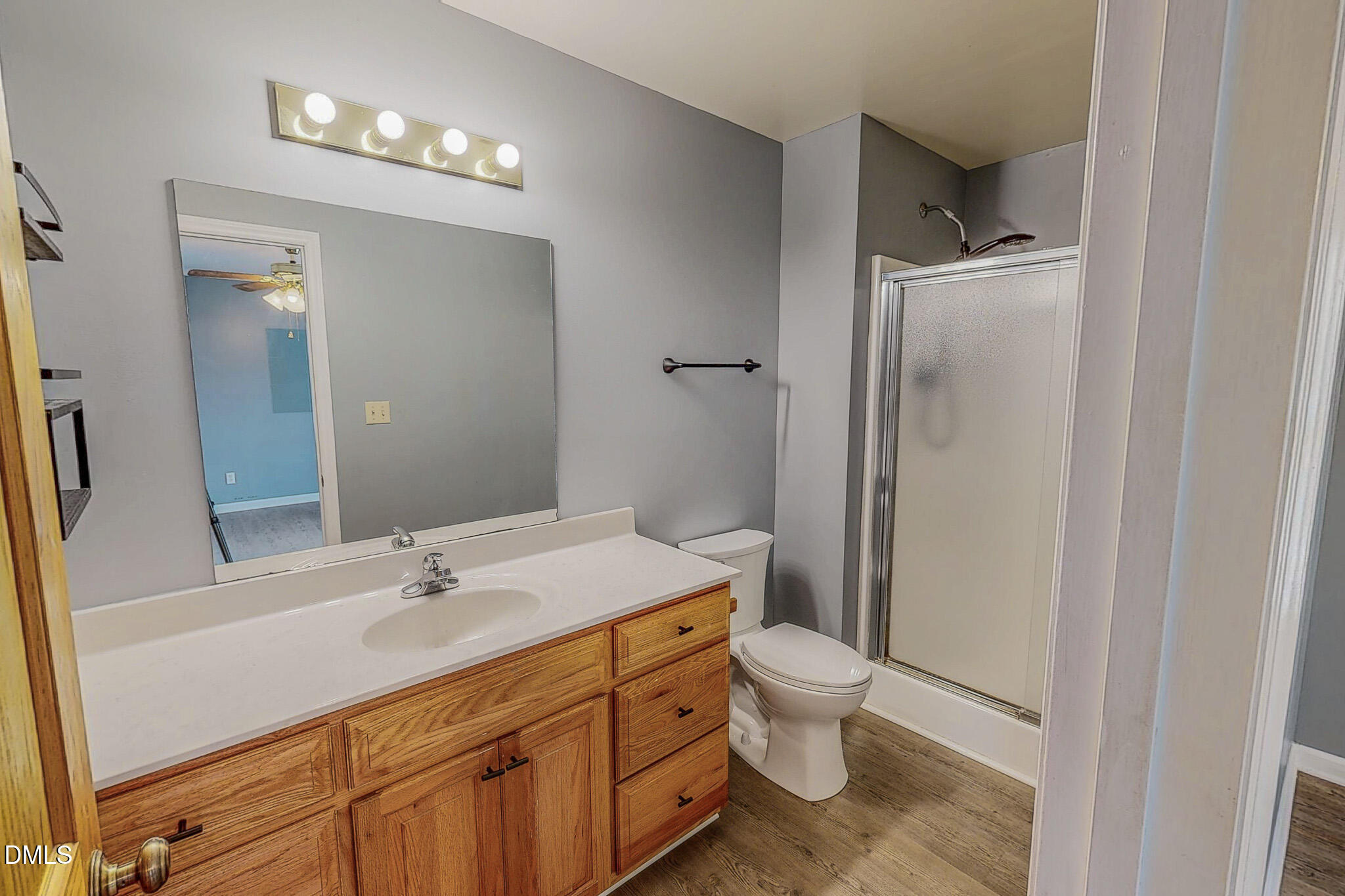 111 Fox Crossing Drive Roxboro, NC 27574 - Photo 15 of 25 a bathroom with a sink a toilet a mirror and shower