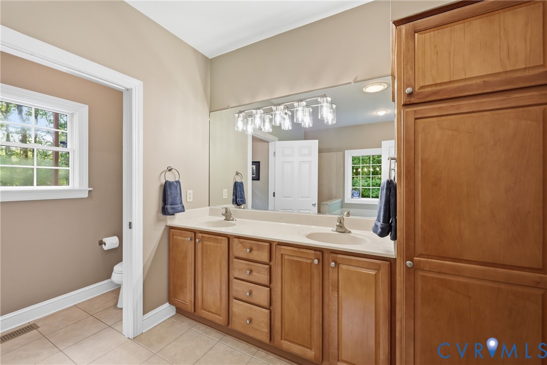 2431 Magnolia Ridge Maidens, VA 23102 - Photo 18 of 43 Double vanities, built-in storage and separate wat