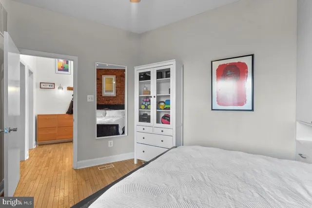 a bedroom with furniture and window