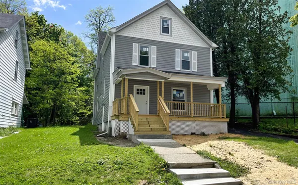 front view of a house with a yard