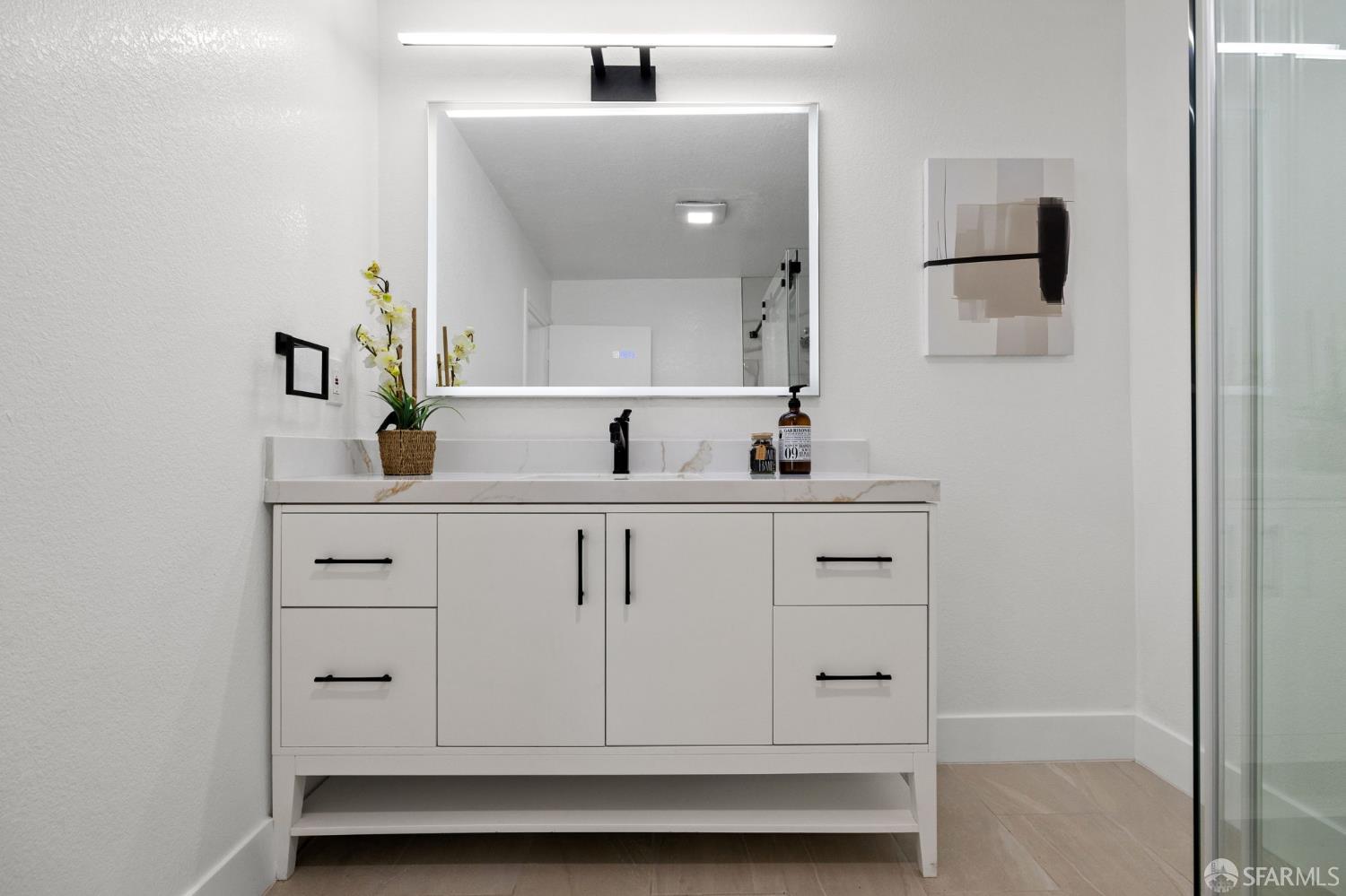 226 Rutledge Street San Francisco, CA 94110 - Photo 16 of 44 a bathroom with a sink vanity and a mirror