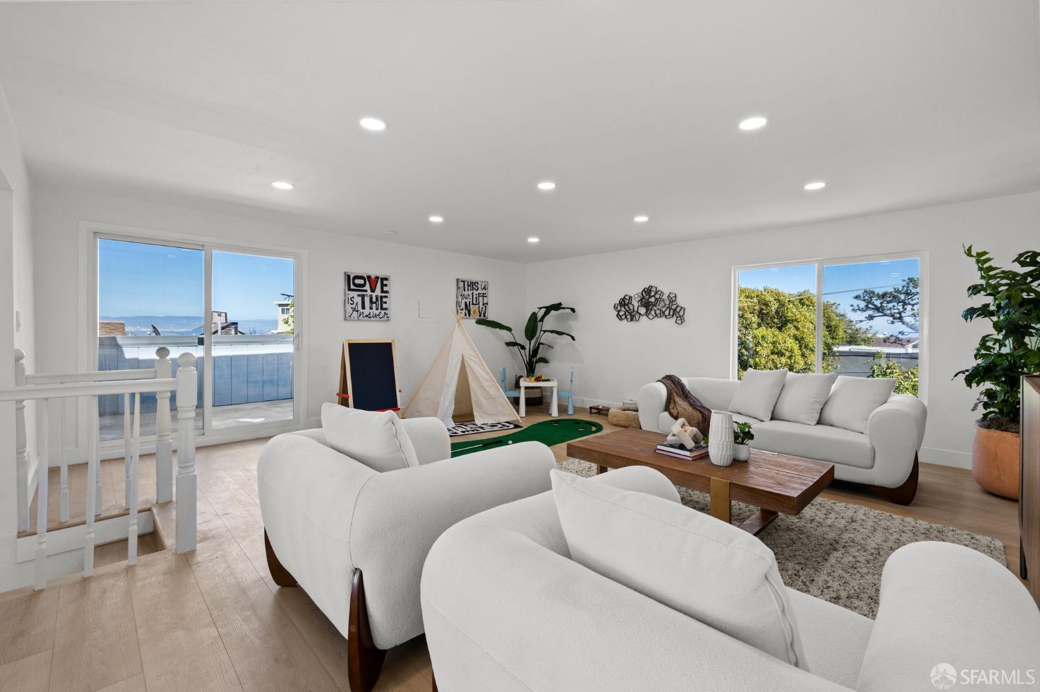 226 Rutledge Street San Francisco, CA 94110 - Photo 19 of 44 a living room with furniture and a large window