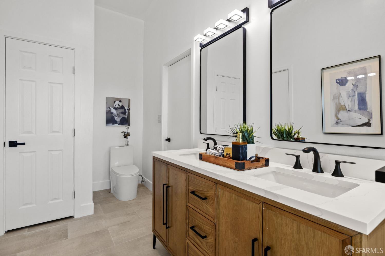 226 Rutledge Street San Francisco, CA 94110 - Photo 22 of 44 a bathroom with a double vanity sink and a mirror