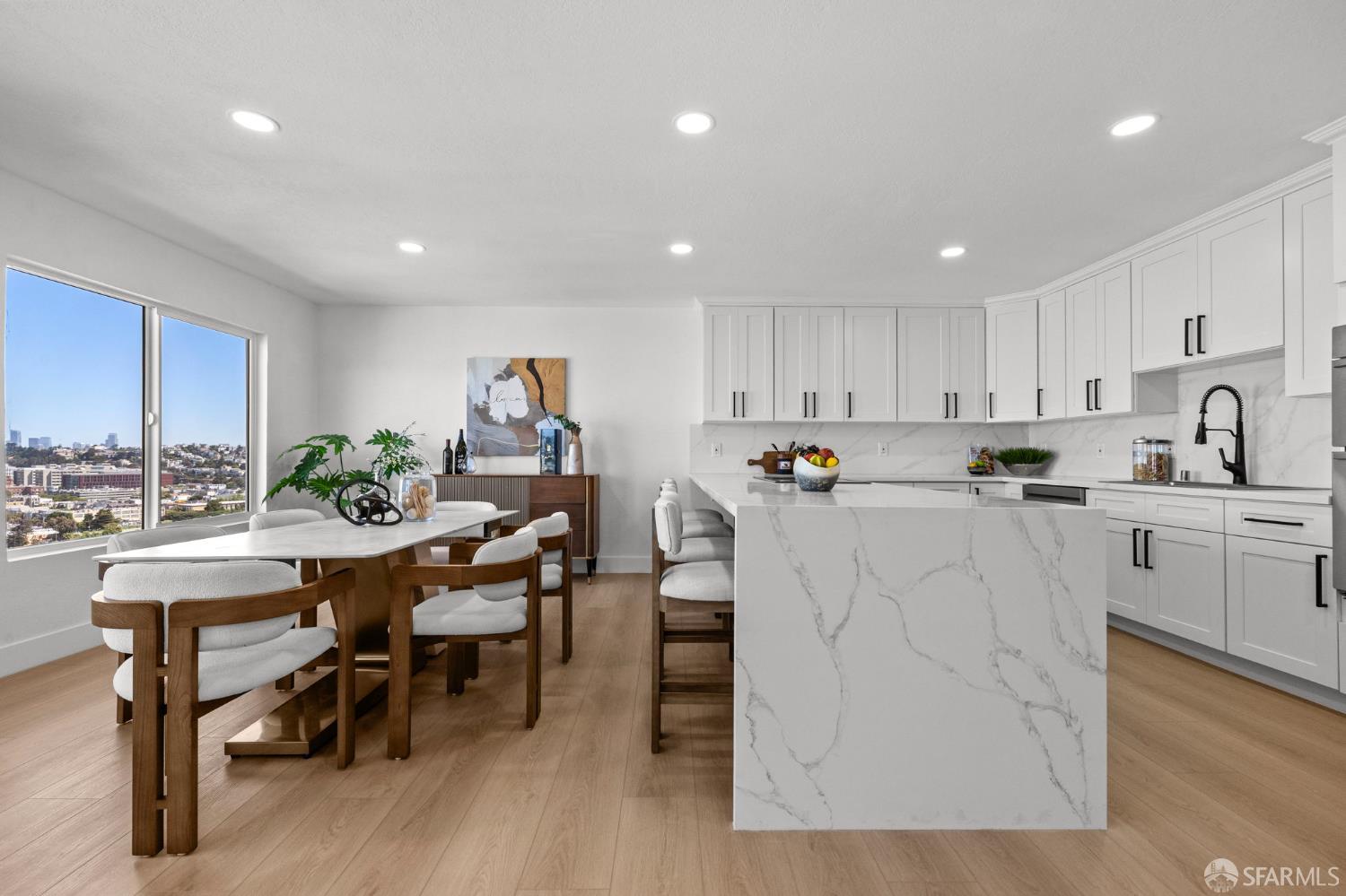 226 Rutledge Street San Francisco, CA 94110 - Photo 3 of 44 a kitchen with white cabinets and chairs